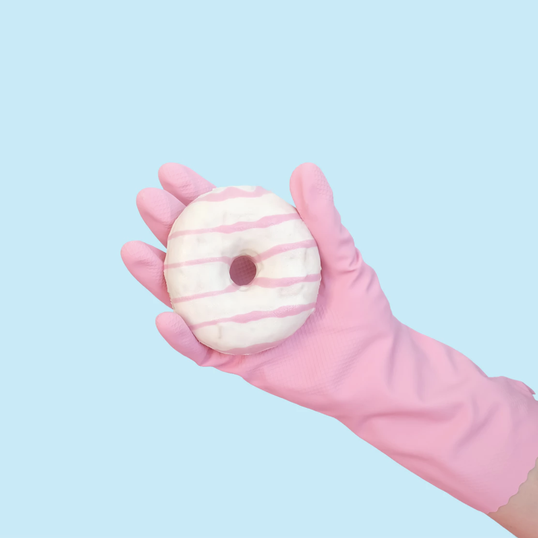 Hand holding a donut